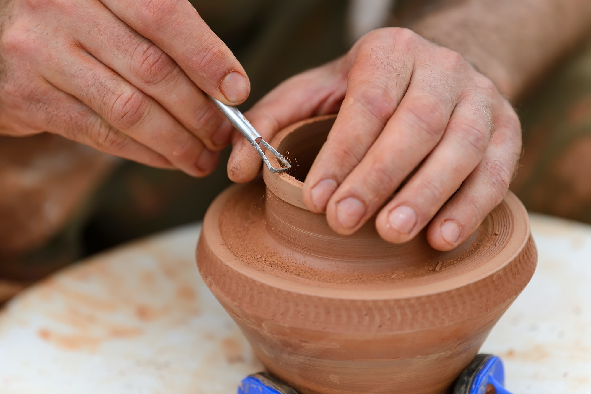potter-making-ceramic-pot-on-the-pottery-wheel.jpg